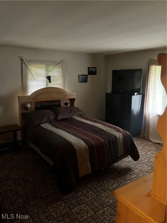 Bedroom featuring multiple windows