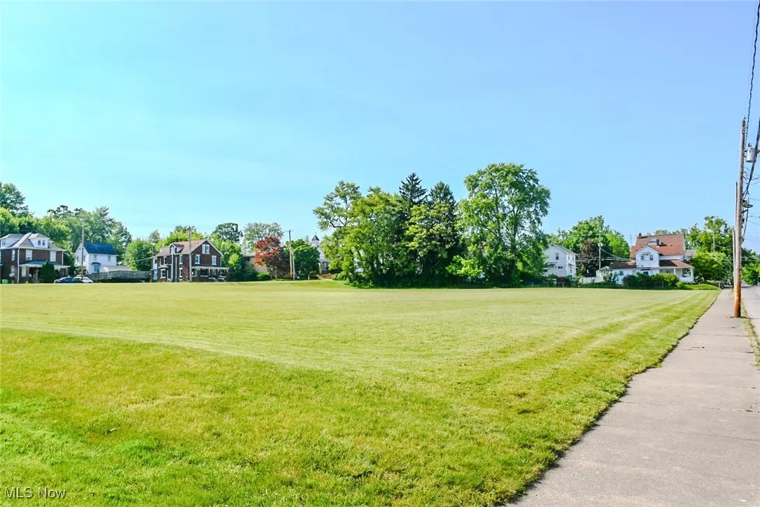 View of grassy field across the street.