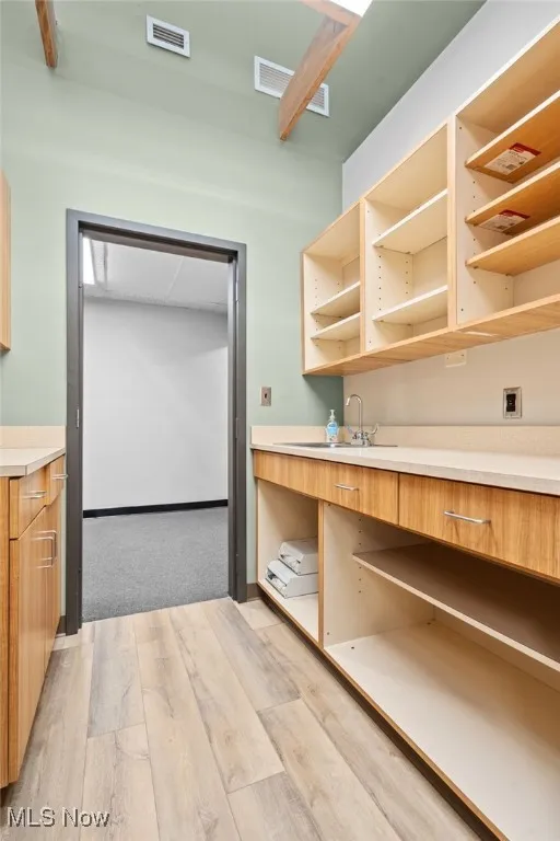 Nurses station with open style cabinets.