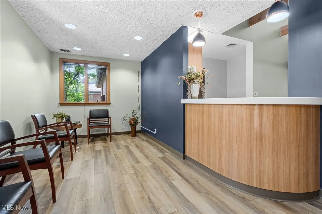 Reception area featuring recessed lighting and a textured​​‌​​​​‌​​‌‌​‌‌​​​‌‌​‌​‌​‌​​​‌​​ ceiling.