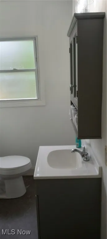 Bathroom featuring vanity and toilet