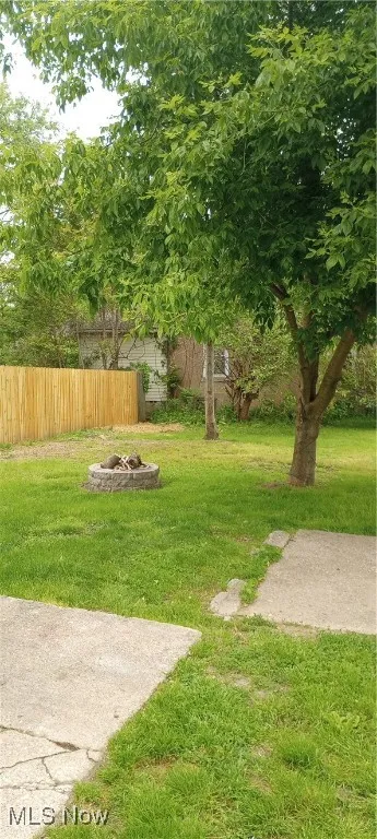 View of yard featuring an outdoor fire pit