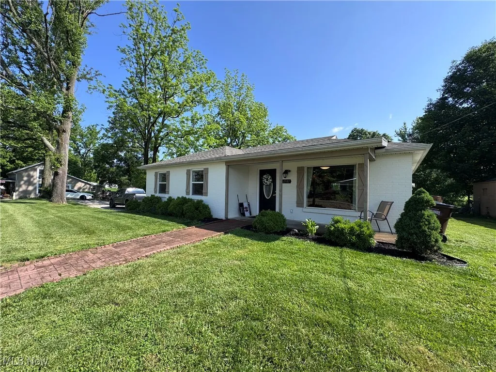 View of front of home featuring a front lawn