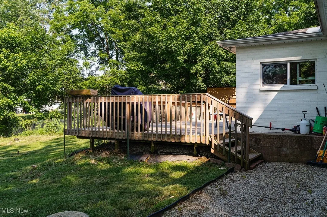 Wooden terrace with a yard
