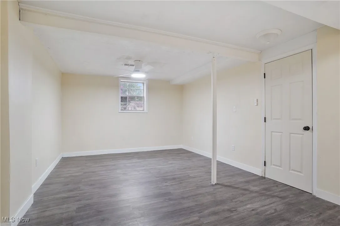 Basement with wood finished floors and baseboards
