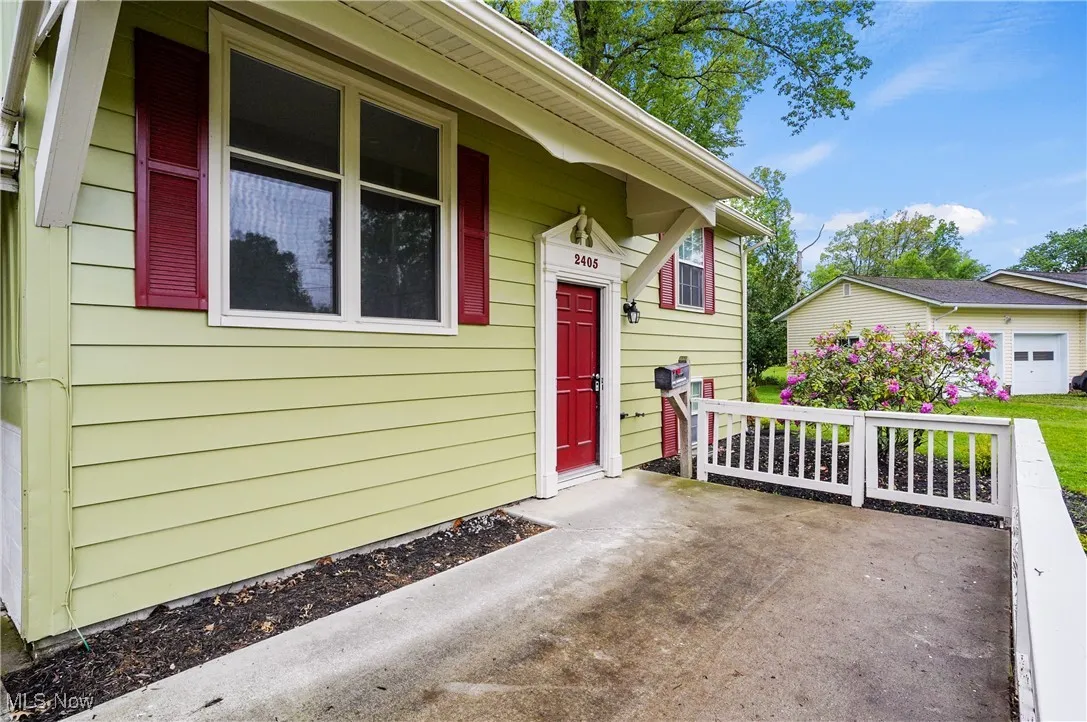 View of exterior entry featuring a porch