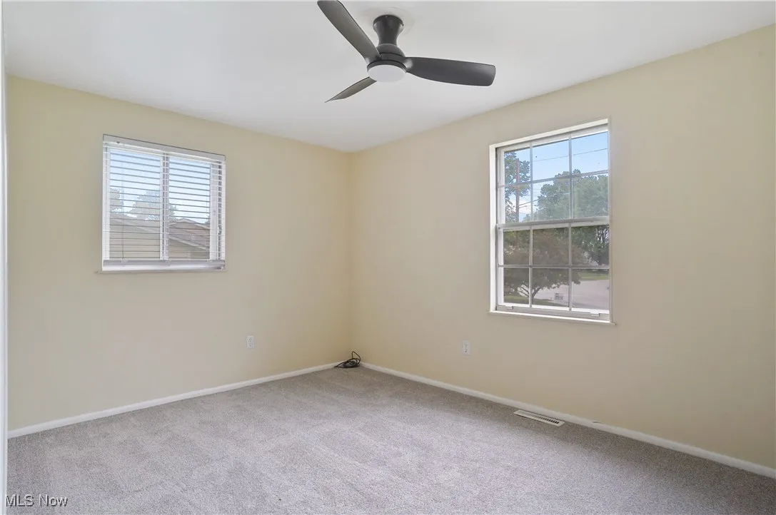Stairway featuring wood finished floors and baseboards