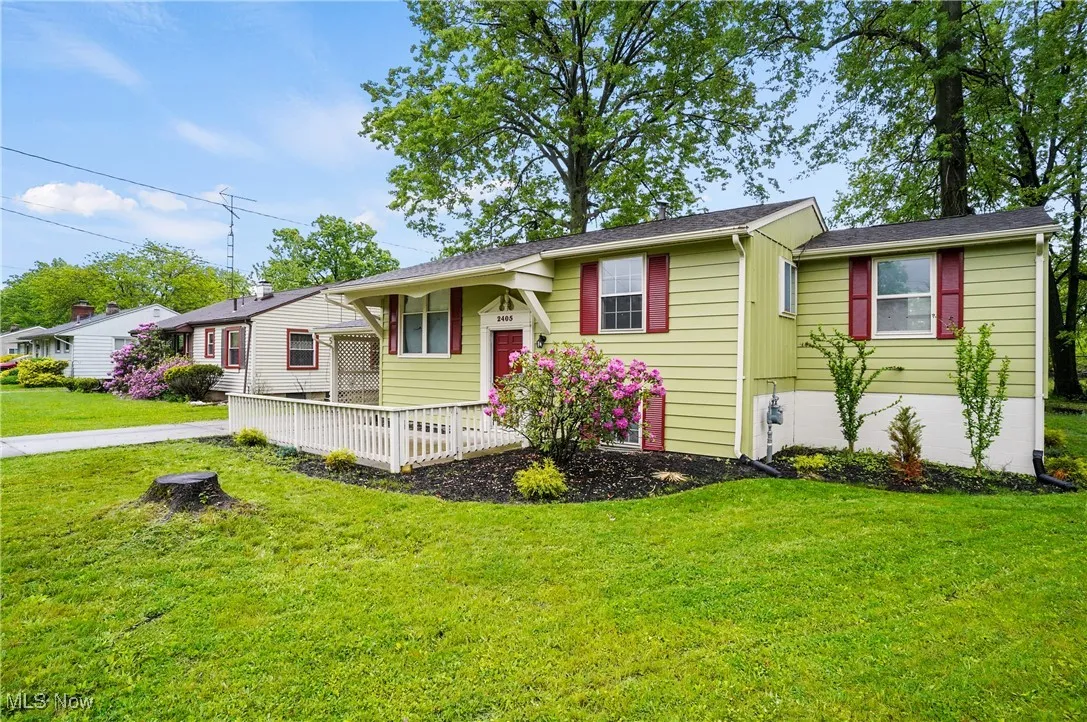 View of front of house with a front lawn and a porch