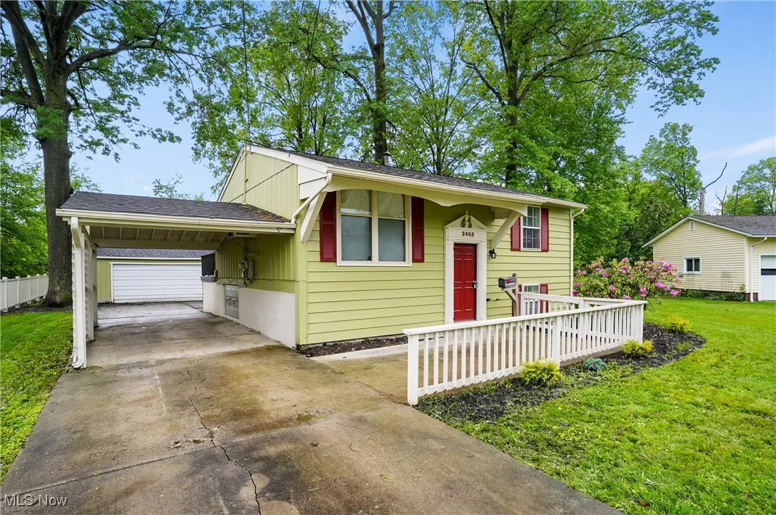 Split foyer home with concrete driveway
