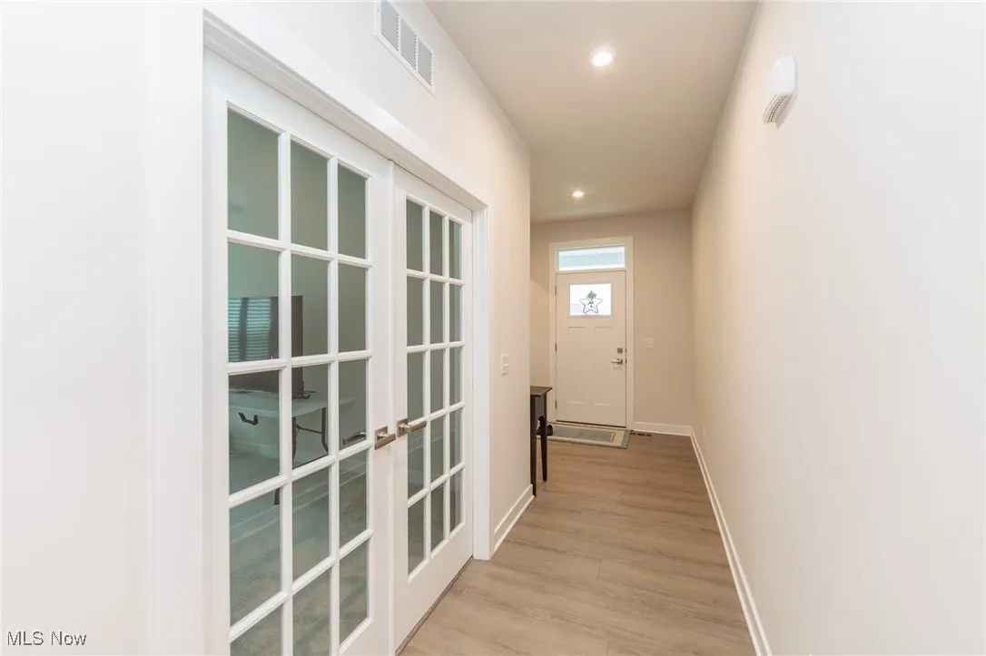 Glass french doors to flex room office den