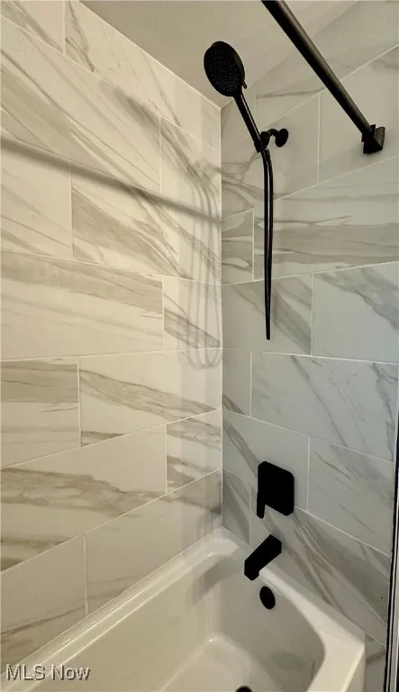Bathroom featuring shower / bathtub combination