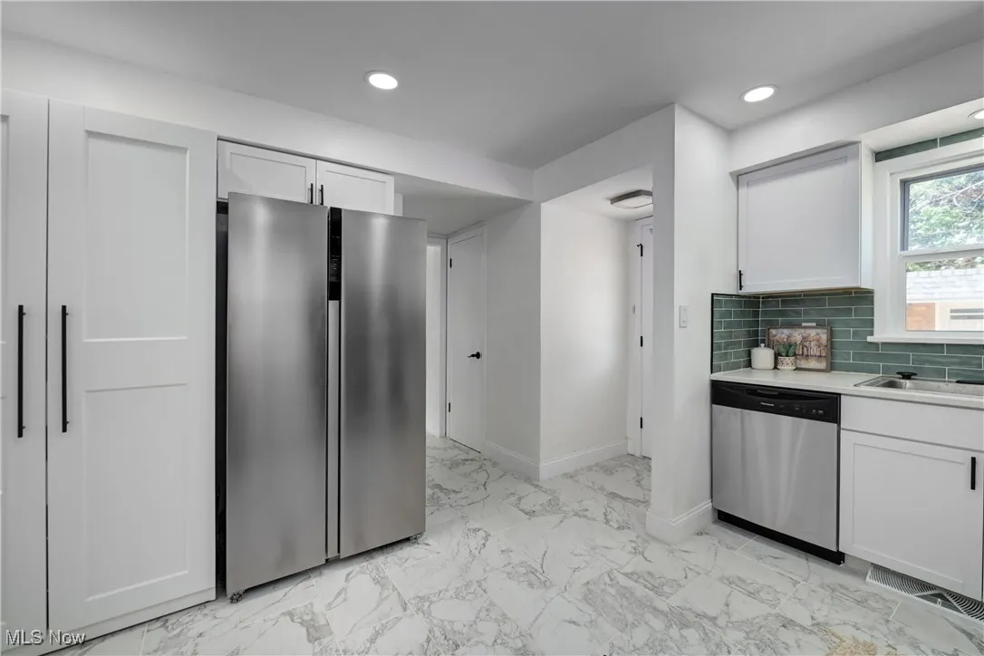 Custom built pantry with lots of shelving and storage.