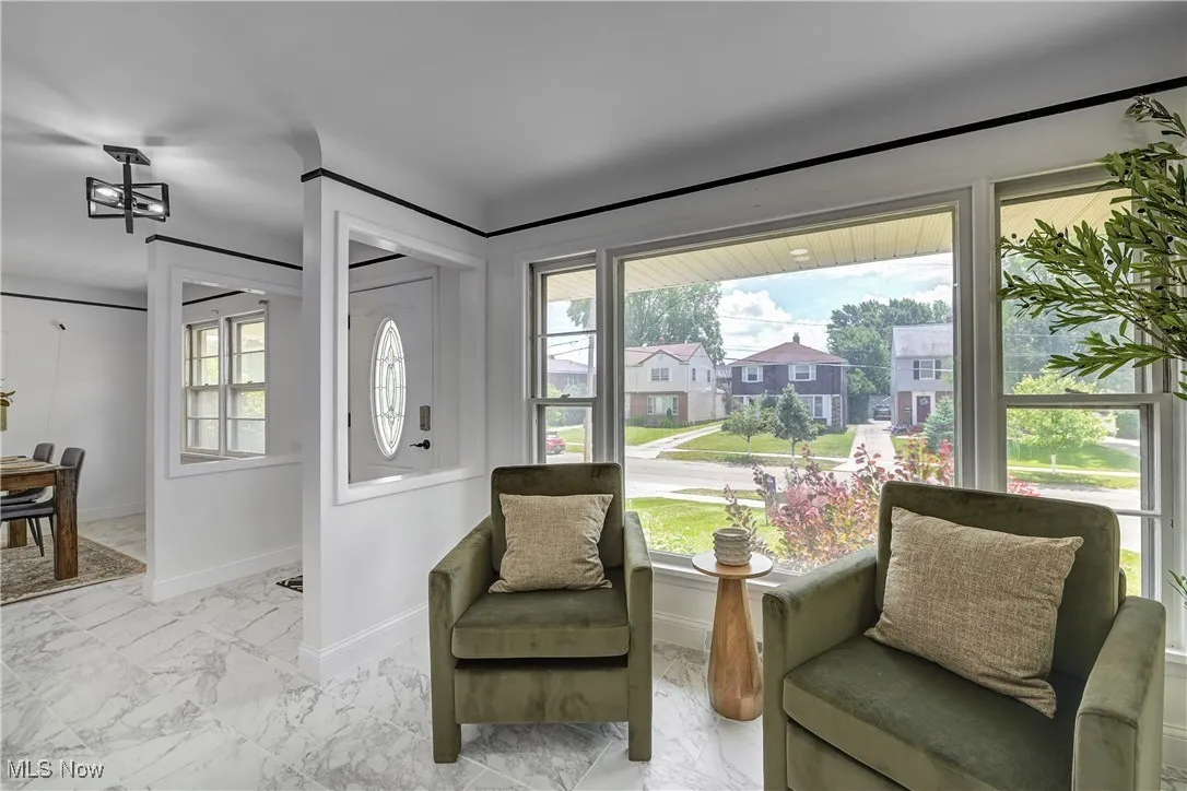 Living area featuring marble look tile flooring