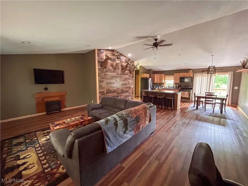 Open concept living room with lofted ceiling.
