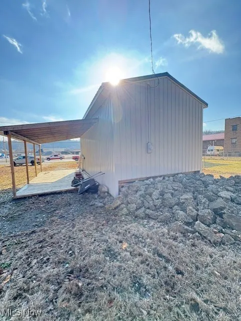 View of outdoor structure with an attached carport