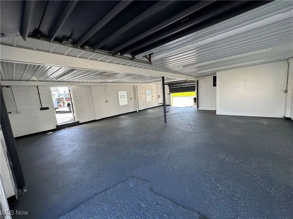 Smaller building 2 garage doors. New Ceiling, support beams
