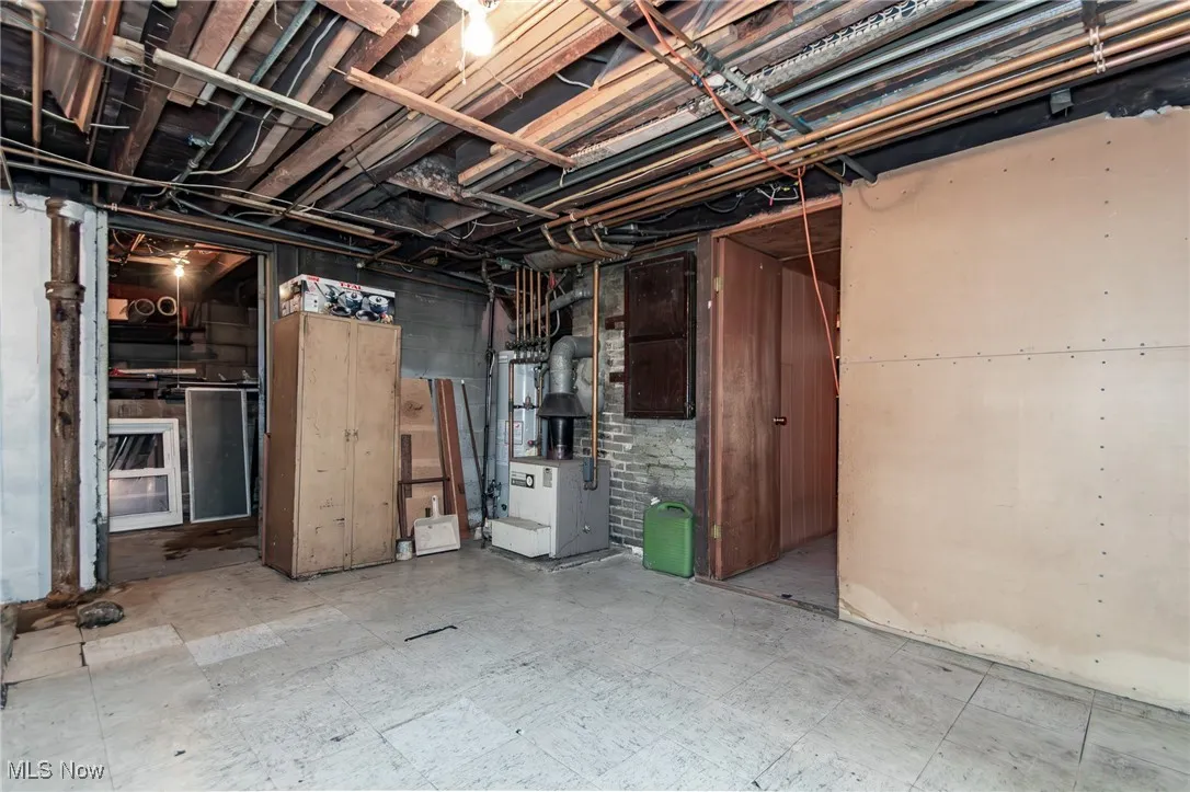 Unfinished basement featuring tile patterned floors