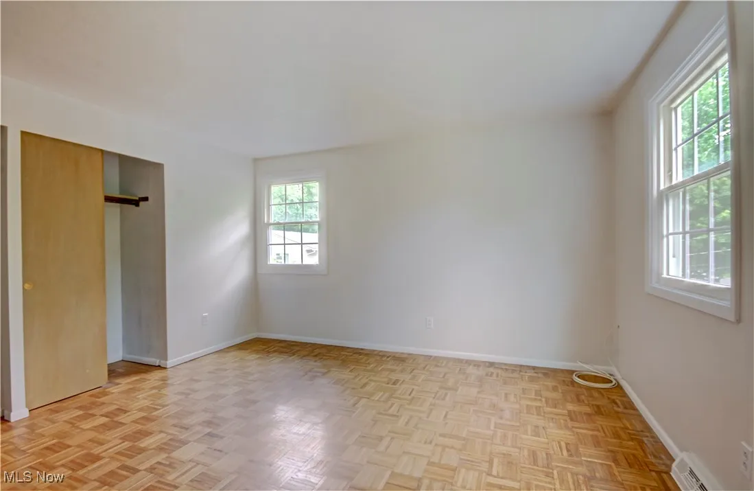 Unfurnished bedroom with baseboards