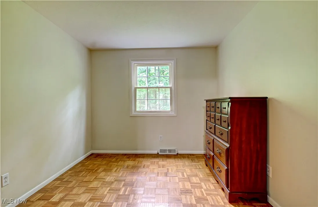 Unfurnished bedroom with baseboards