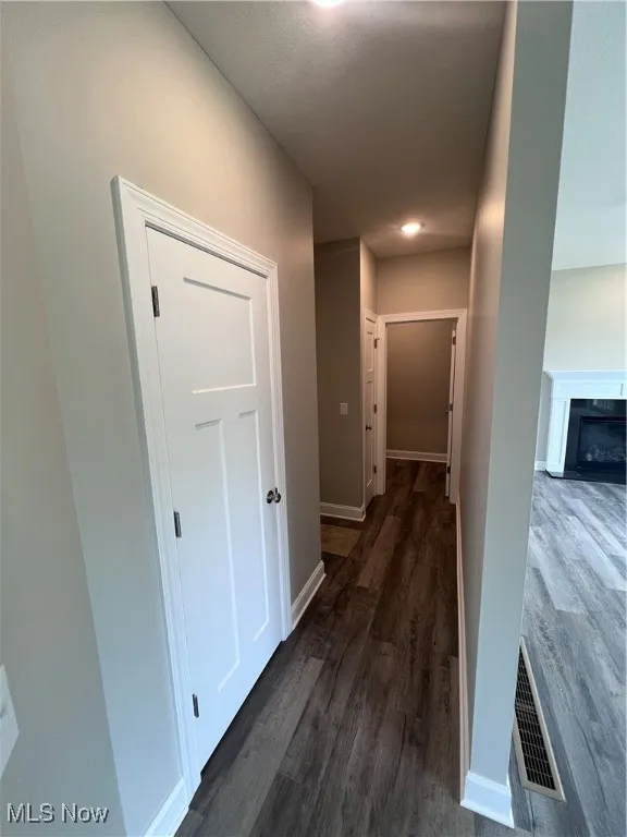 Downstairs half bathroom, garage entrance and laundry room
