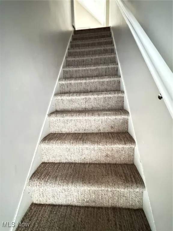 View of staircase entrance to 2nd floor apt.