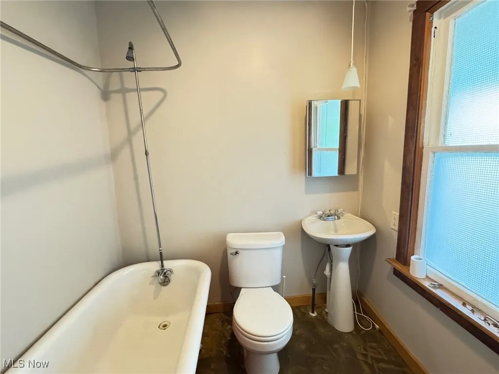 2nd floor Full bathroom with a freestanding bath, baseboards, a shower, toilet, and a sink