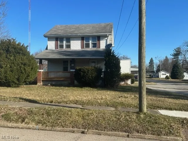 View of front of home featuring a porch and a front yard