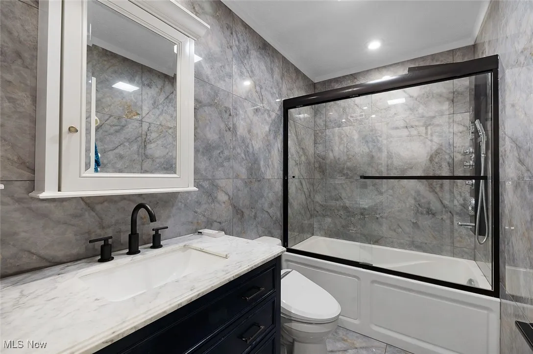 Guest full bath on second floor has beautiful Italian Tile on the floors and walls!  Also upgraded shower package!