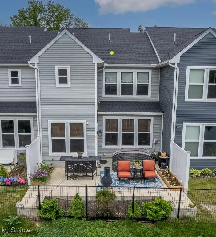 The back yard has a super spacious concrete patio using the space to the fullest!