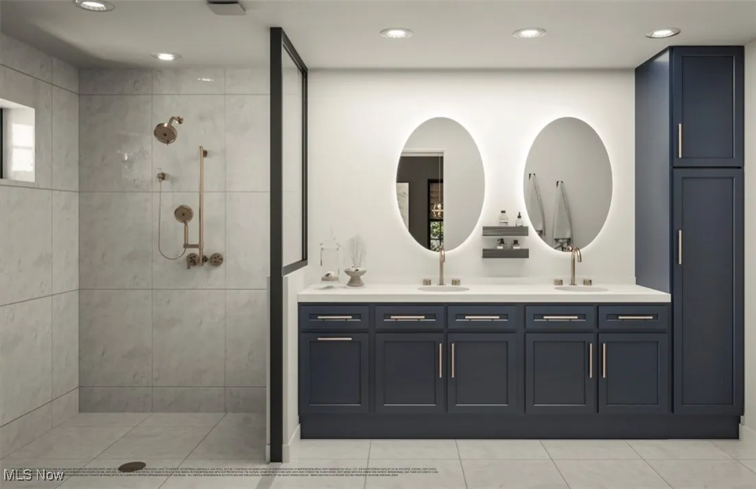 Bathroom with double vanity, walk in shower, recessed lighting, and tile patterned floors