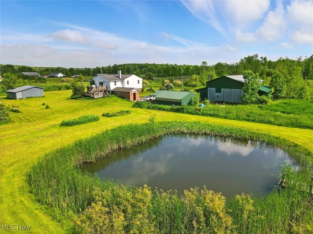 View from above of property with a large body of water