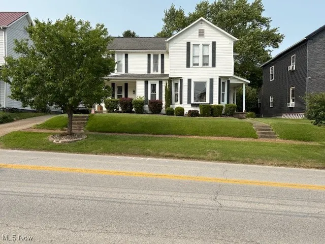 View of front of property with a front yard
