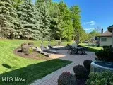 View of grassy yard with a patio