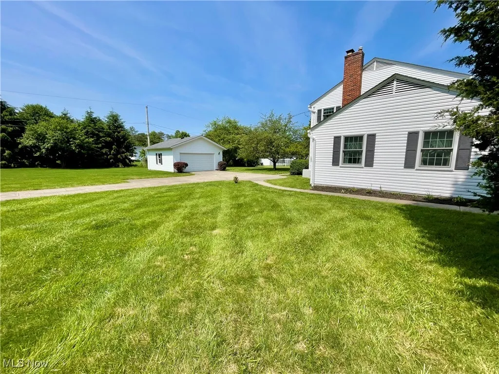 Side of home - 2 car garage - large driveway
