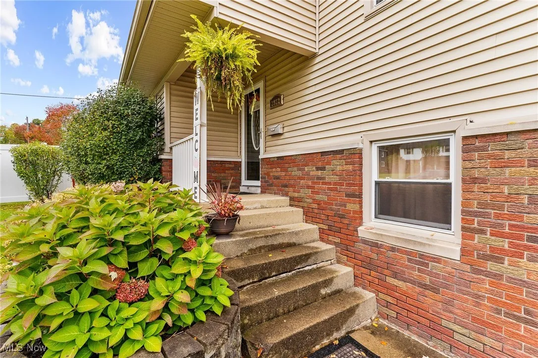 Entrance to property with brick siding