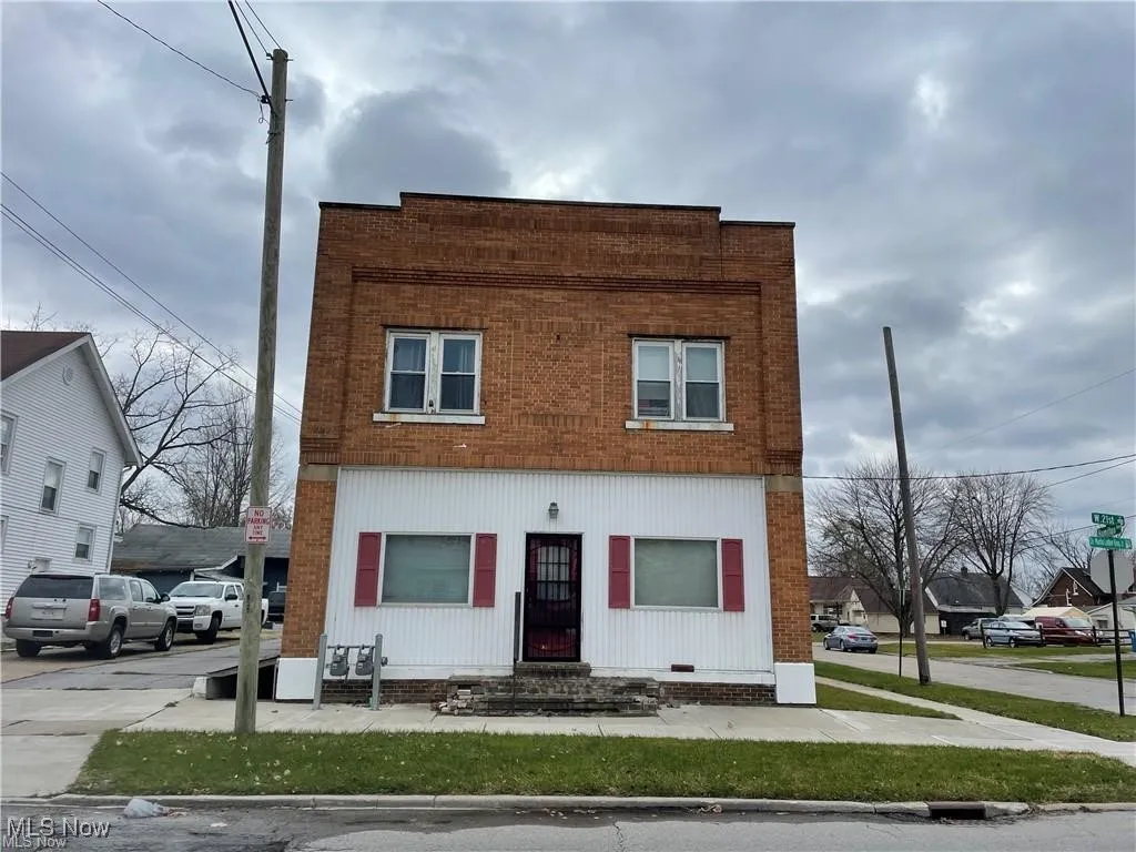 View of front facade featuring brick siding