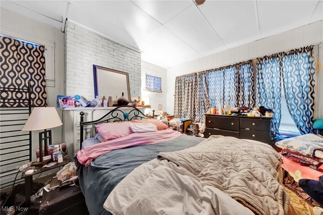Bedroom with brick wall