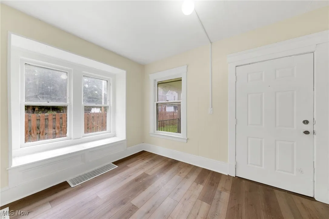 Entrance foyer featuring wood finished floors and baseboards