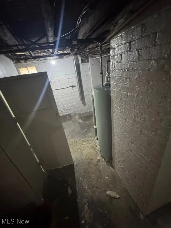 Unfinished basement with water​​‌​​​​‌​​‌‌​‌‌​​​‌‌​‌​‌​‌​​​‌​​ heater