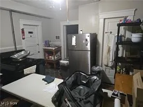 Kitchen featuring freestanding refrigerator