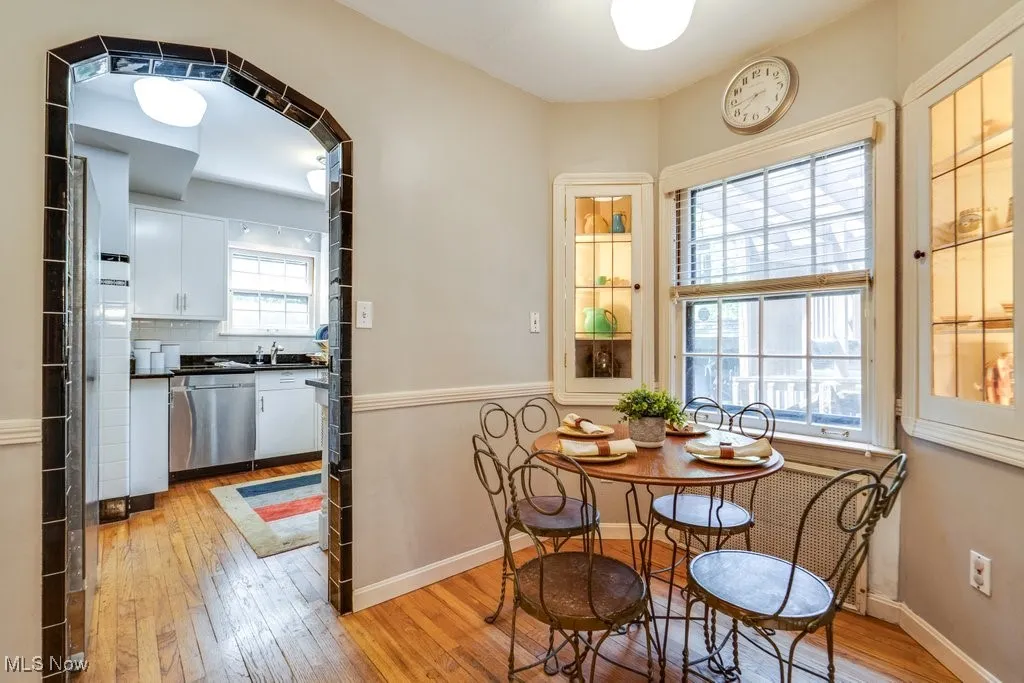Dining room featuring light wood-style flooring and baseboards