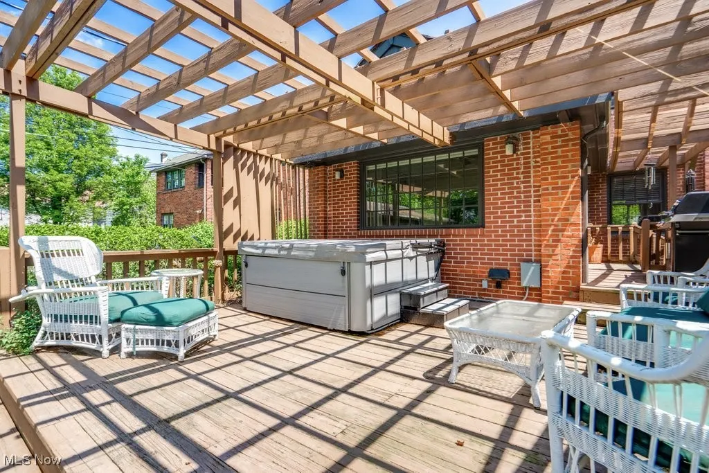 View of deck, a pergola, and grilling area