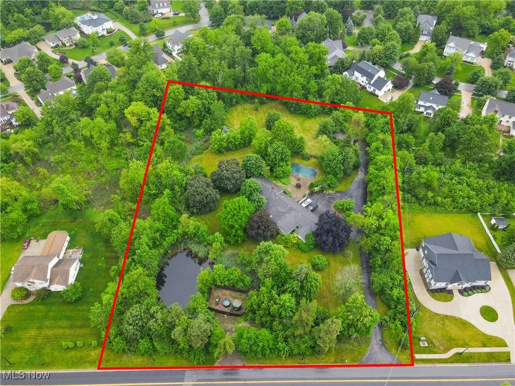 Aerial view of residential area with property boundaries highlighted