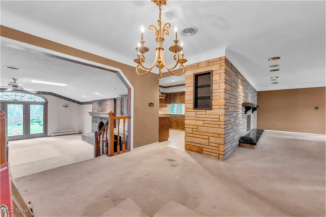 Dining Room w/carpet-hardwood floor is central to Family Room, Kitchen, and Living Room
