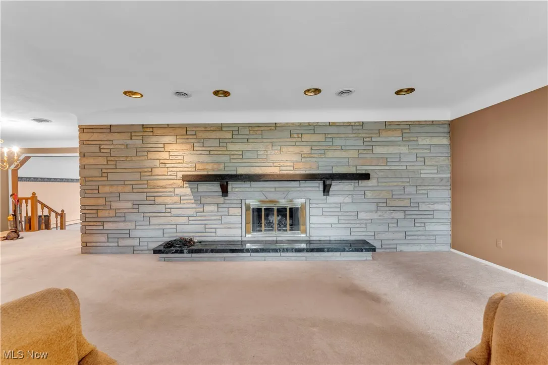  Living room featuring a fireplace, and recessed lighting open to Dining Room