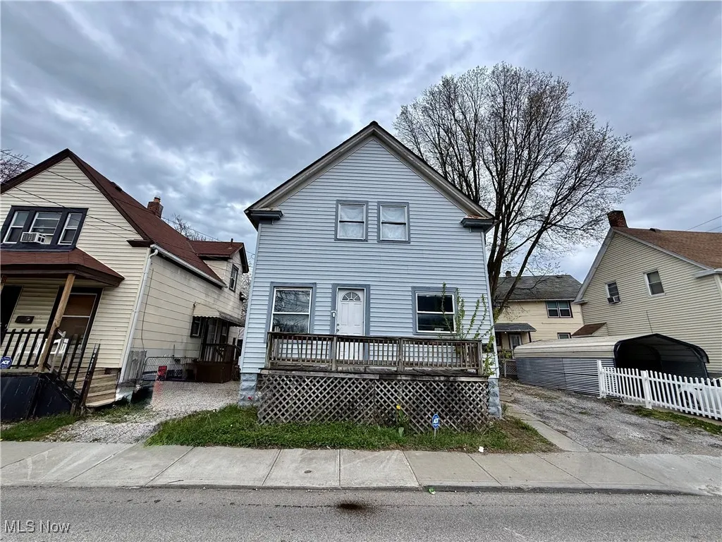 View of front of house featuring fence