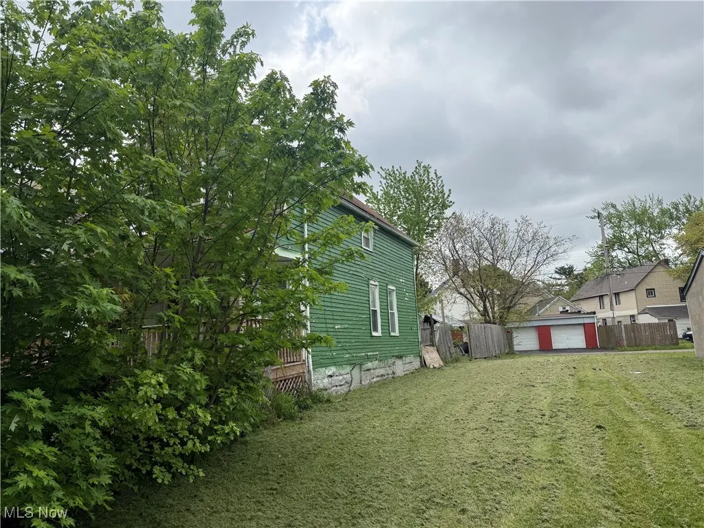 View of yard with a detached garage