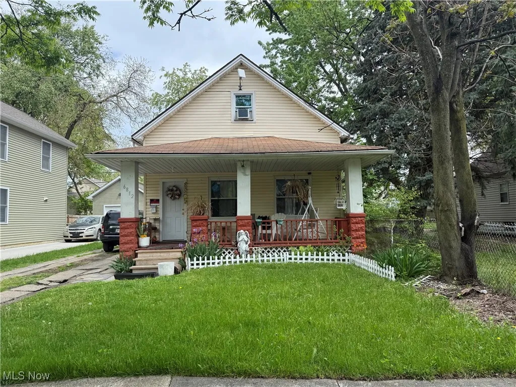 View of front of property featuring a porch and a shingled roof