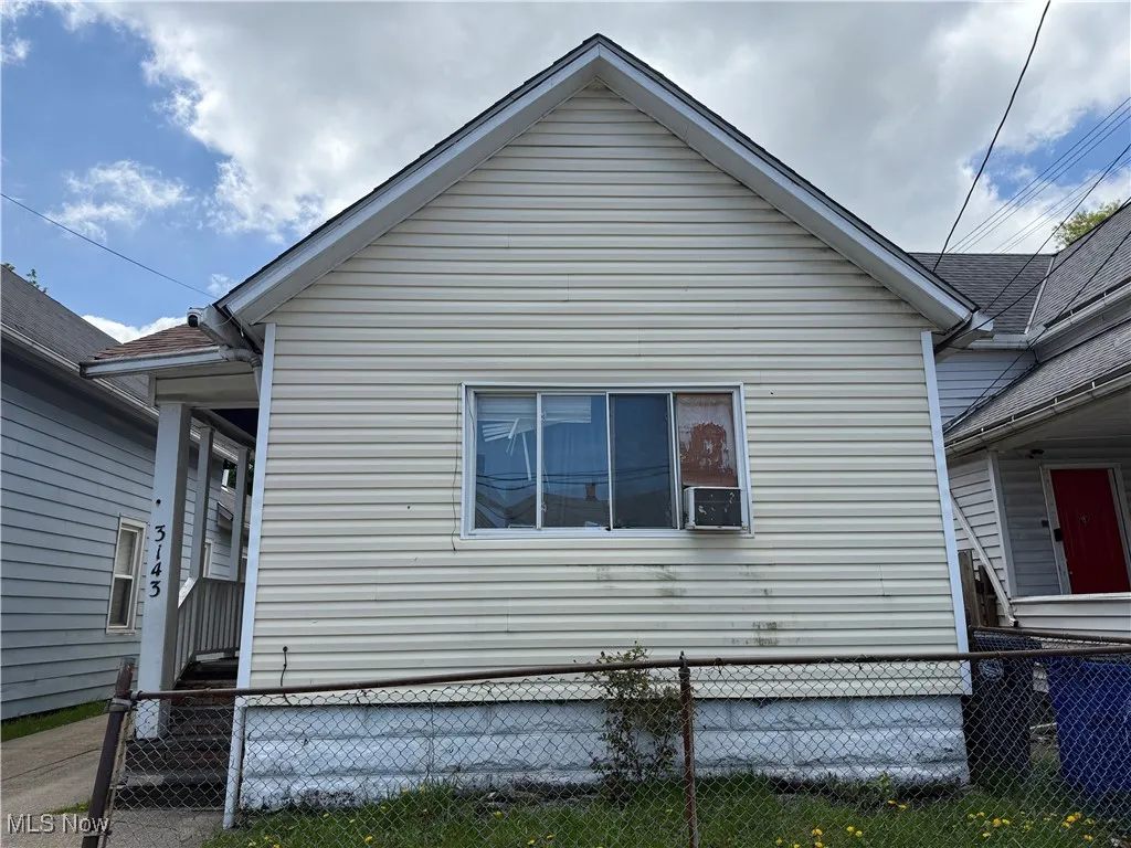 View of side of property with fence