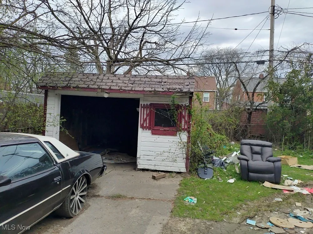 View of outbuilding featuring an outbuilding and concrete driveway